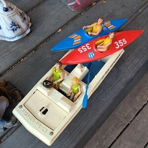 Vintage Fisher-Price Racing Boat with Colorful Kayaks